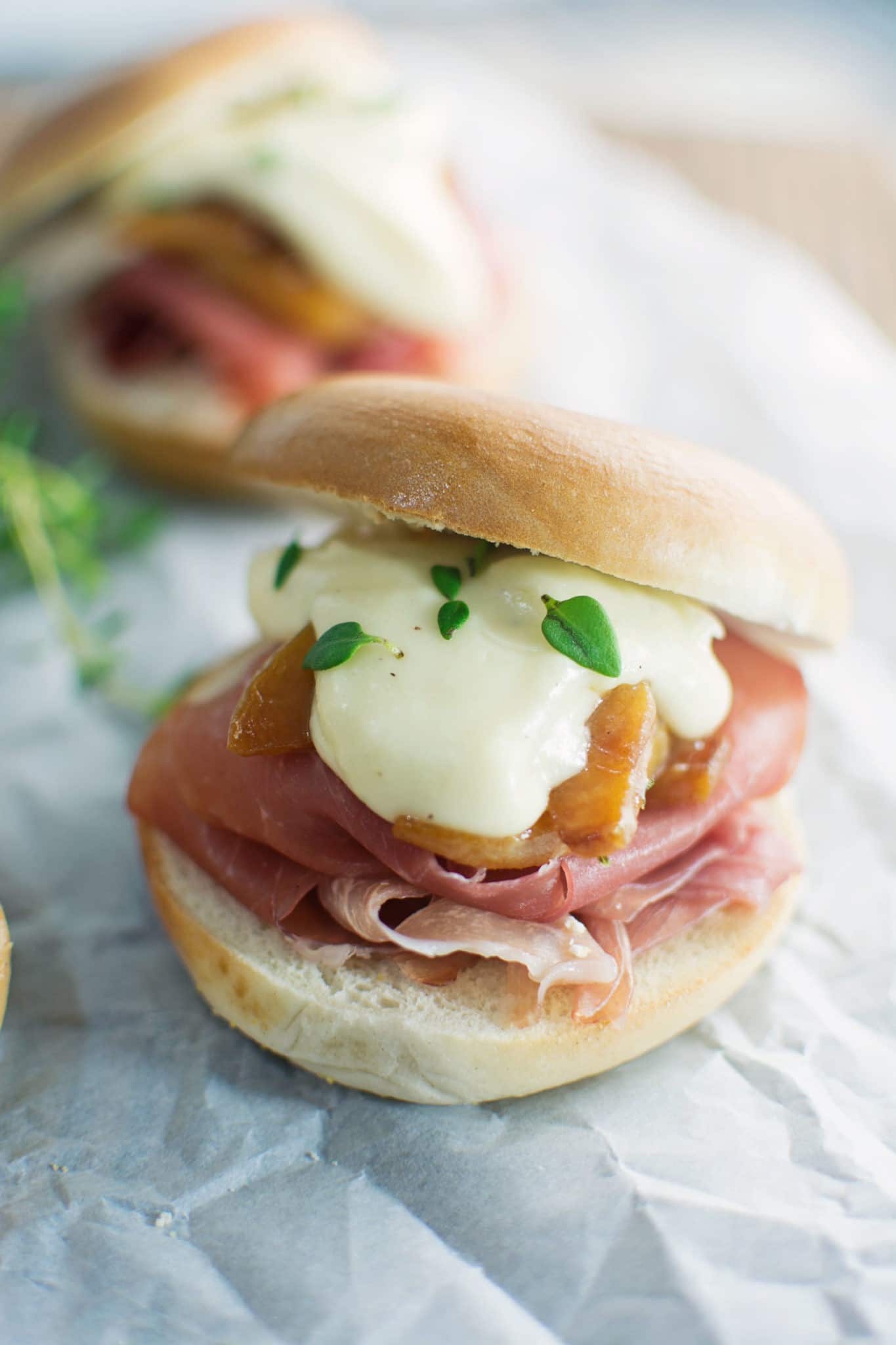 Prosciutto & peaches with a creamy brie sauce make these delectable Bagel Sliders - Find the #recipe @LittleFiggyFood