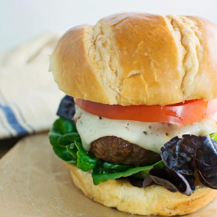 Harvarti, heirloom tomatoes and artisan lettuce top the best Flippin' Burger! Recipe @LittleFiggyFood