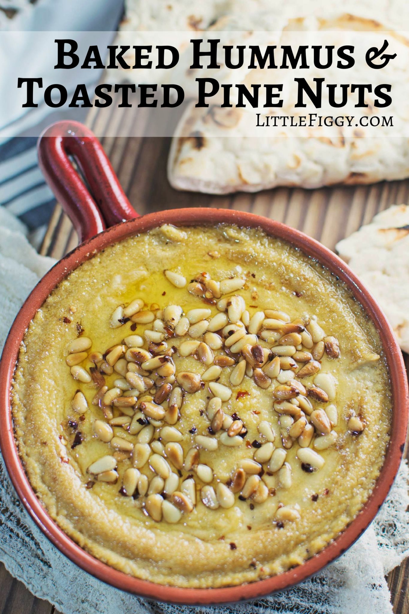 Try this Baked Hummus topped off with buttery, toasted pine nuts and served up with some pita bread! It's great for your next get together, or as a snack. Recipe @LittleFiggyFood