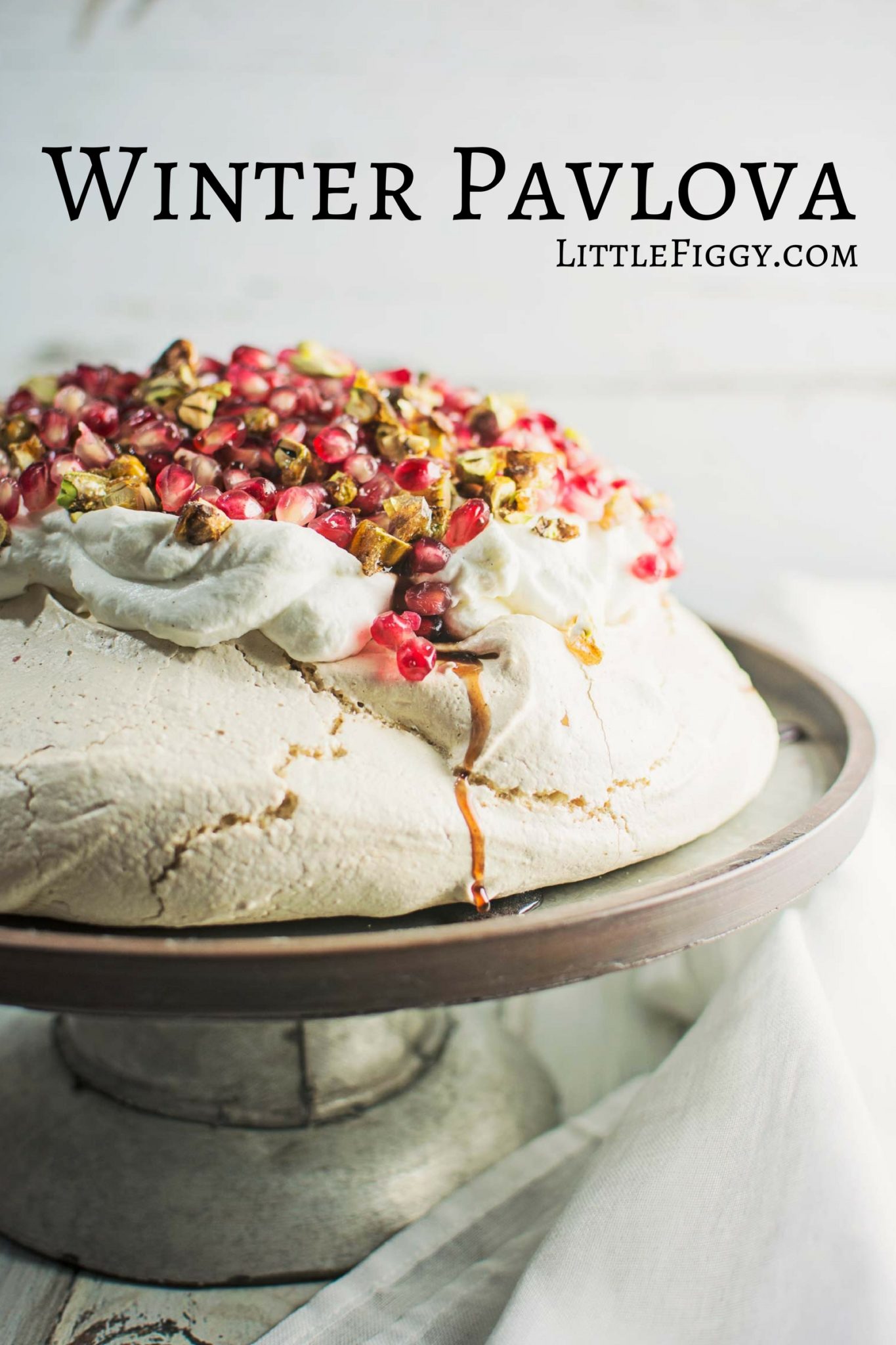 A gorgeous Winter Pavlova, with scattered pomegranate seeds, and topped off with pistachio brittle and plenty of cardamom scented cream! Recipe @LittleFiggyFood