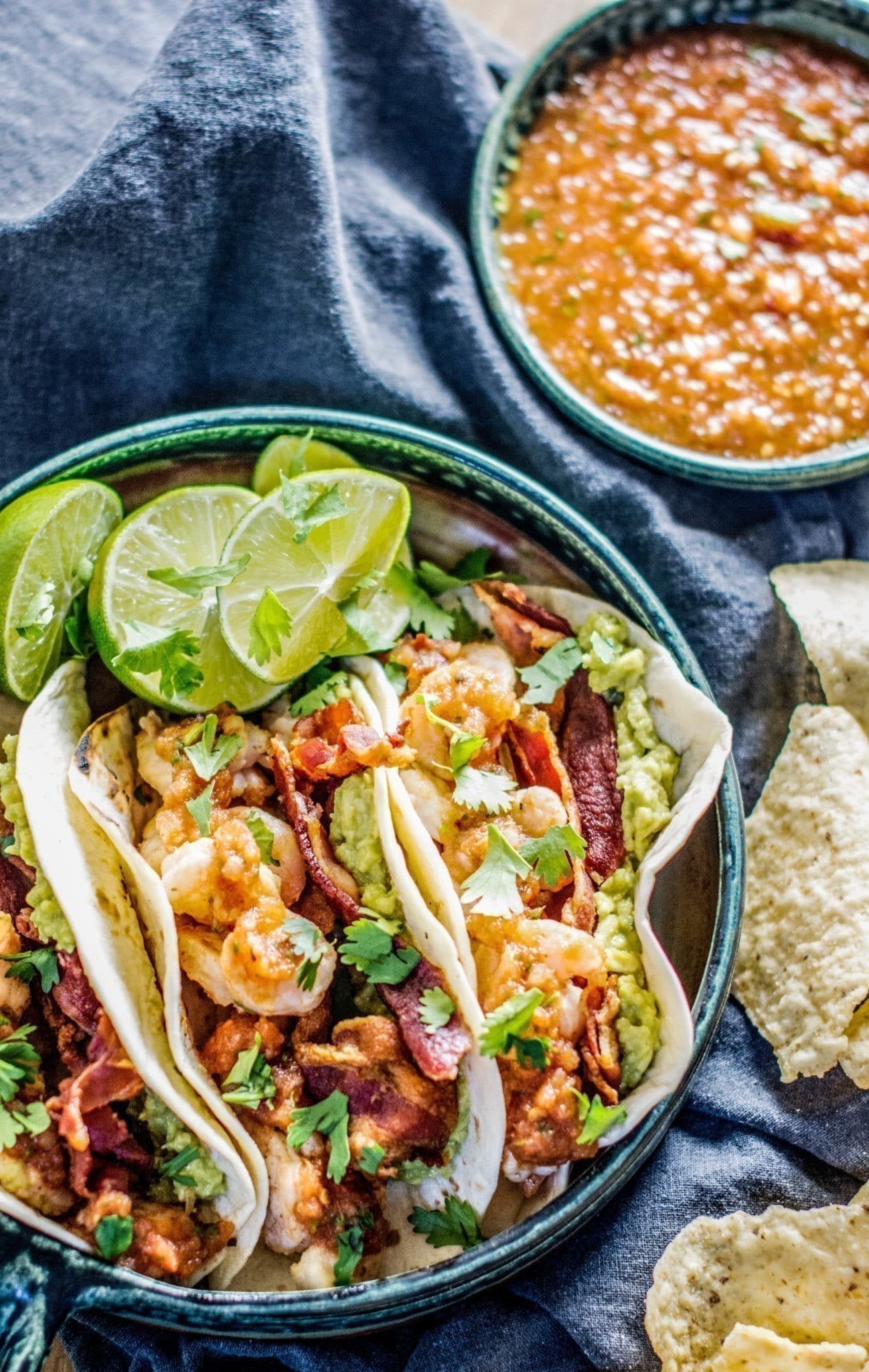 Make this amazing Tequila Shrimp Tacos and pile on the bacon and roasted chipotle salsa! Get the recipe at Little Figgy Food