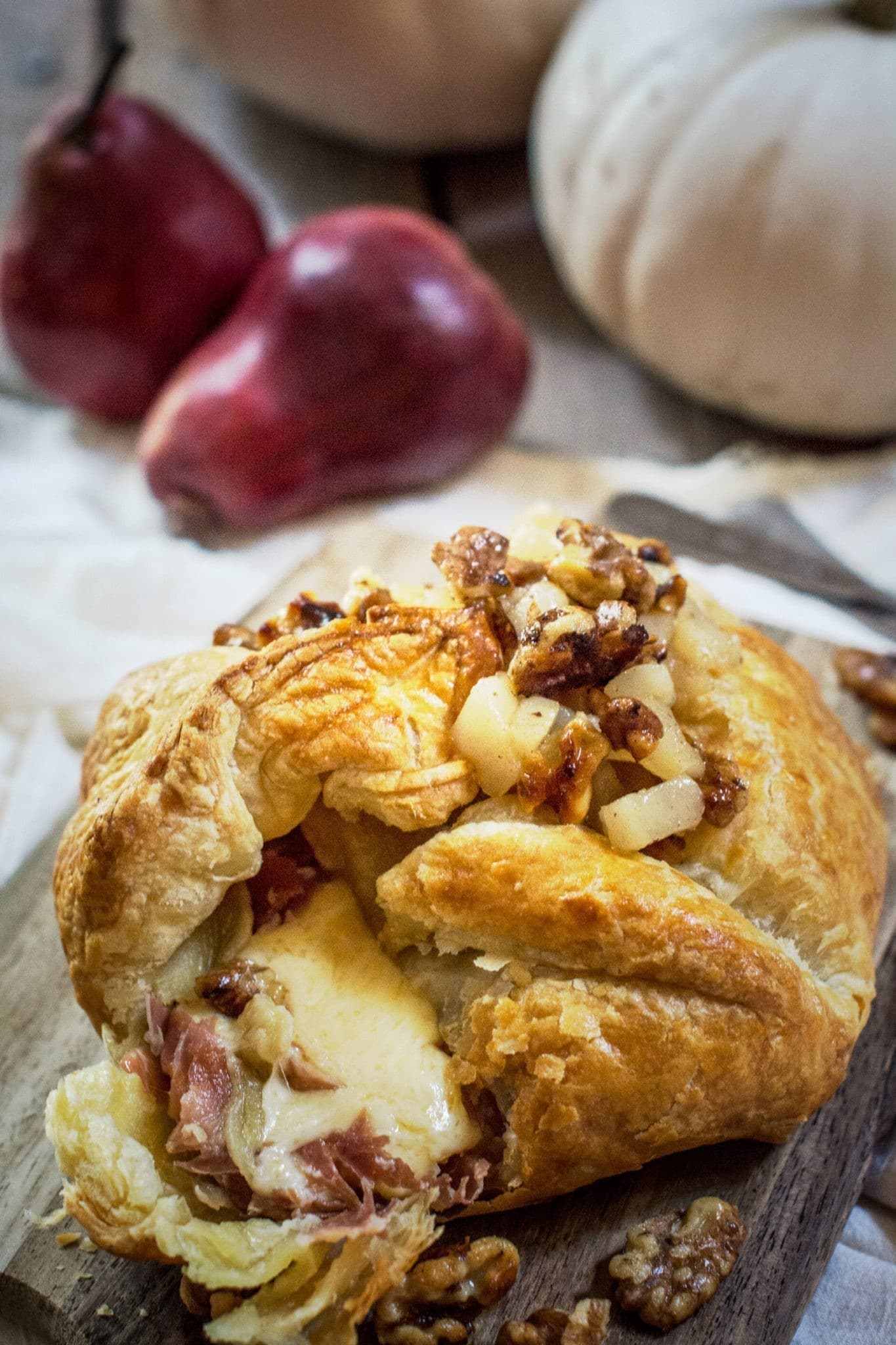 Make this gorgeous appetizer for your next get together, Bake Gouda! It's full of layers of flavors, wrapped in Prosciutto, then baked in a puff pastry and topped off with a warm Pear and Walnut Compote! Get the recipe at Little Figgy Food.