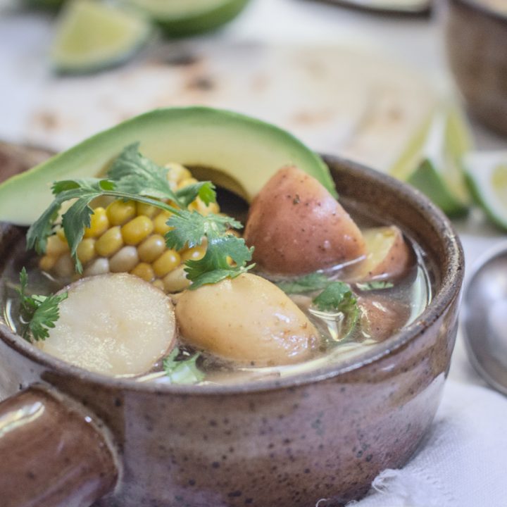 Ajiaco - Chicken Corn and Potato Stew with avocado slices