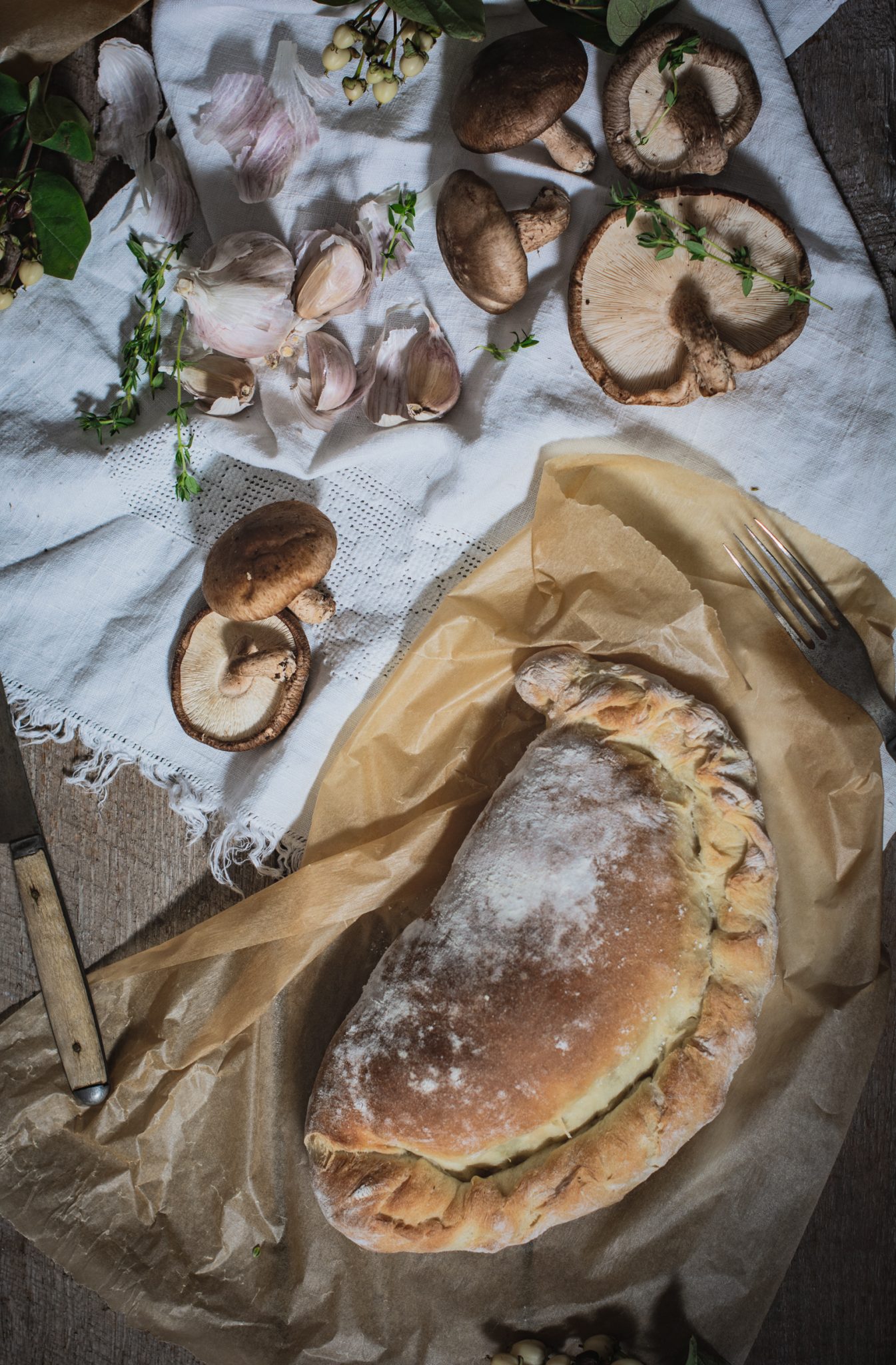 Whole wild mushroom, garlic and potato calzone recipe, baked and ready to serve.