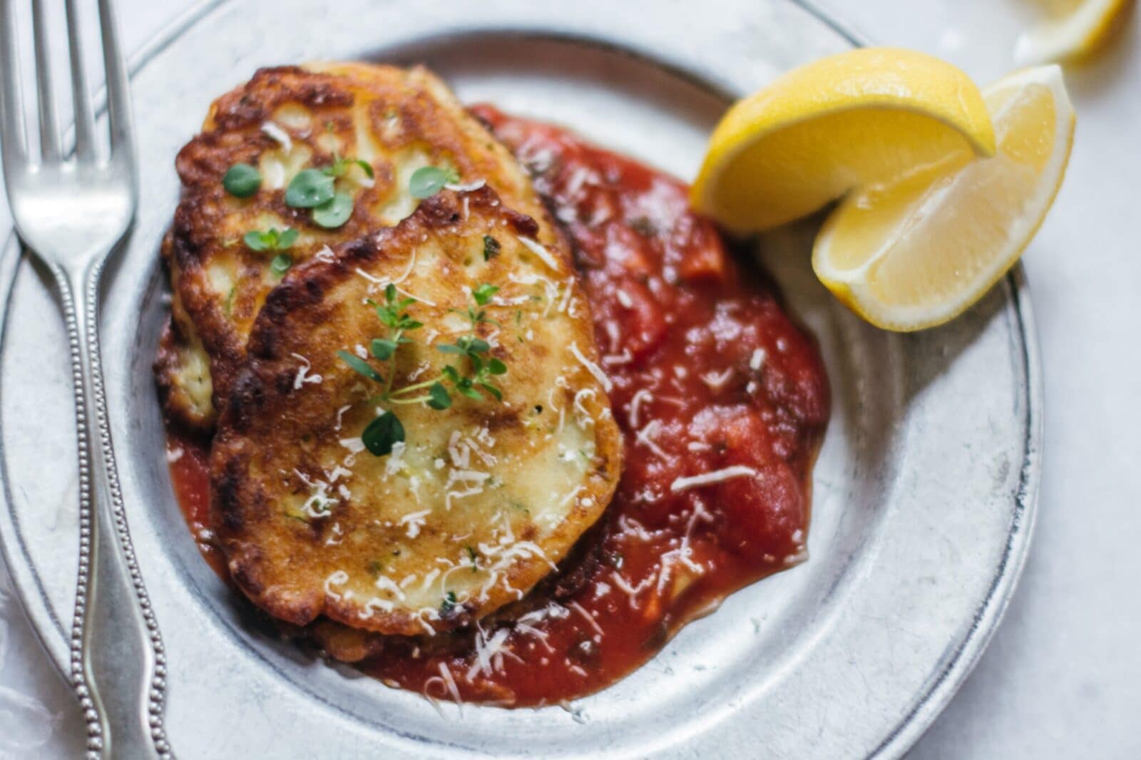 Serving Ricotta Cakes with Tomato Sauce