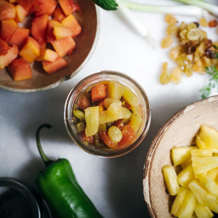 Jar of pineapple salsa and ingredients