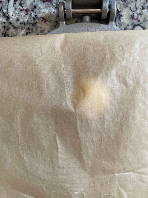 parchment covered tortilla dough
