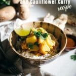 Potato Curry with rice and lime wedge in bowl